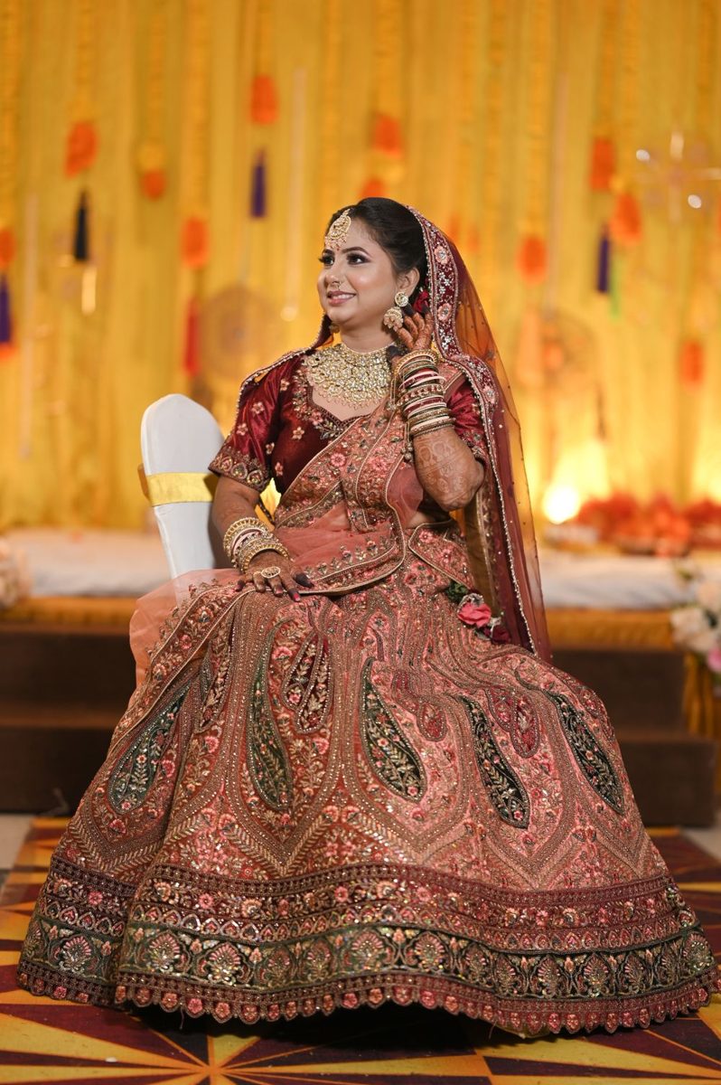 Bride in a rose gold lehenga